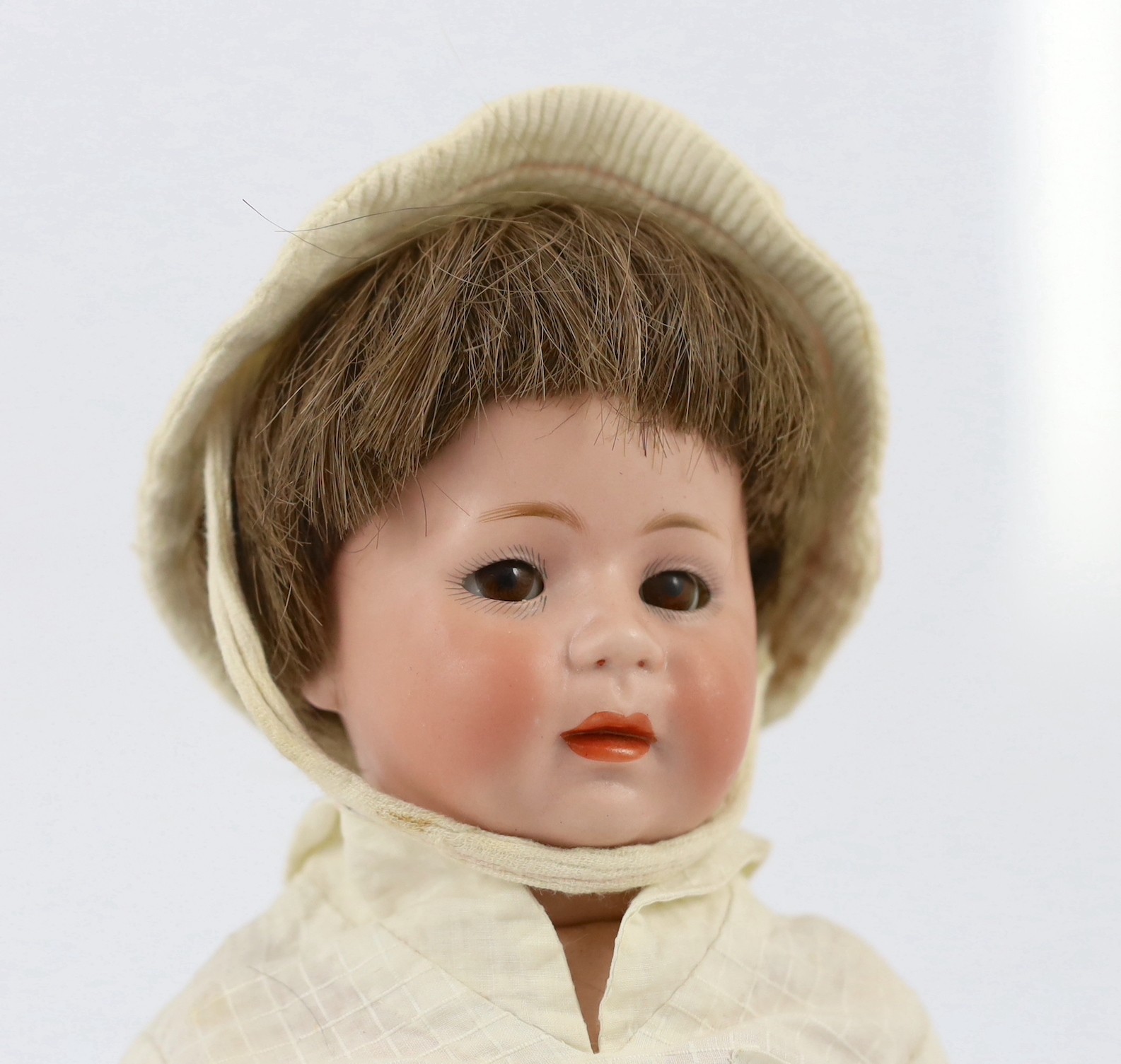 A Simon & Halbig bisque character doll, German, circa 1920, 13.25in.